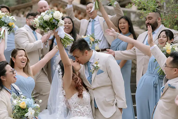 Joyful winter wedding in Taormina Sicily with bride and groom celebrating with their guests