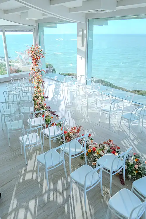 Indoor wedding ceremony setup overlooking the Adriatic Sea in Abruzzo