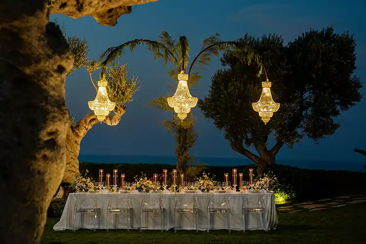 Luxury outdoor wedding dinner under olive trees at Villa Estea in Abruzzo with sea view