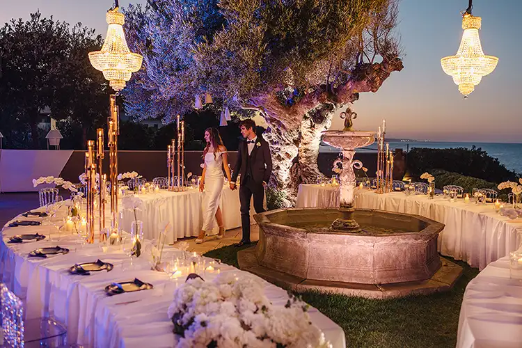 Romantic wedding reception at sunset in an Italian villa overlooking the Adriatic Sea