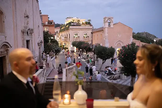Romantic evening in Taormina historic centre overlooking Piazza IX Aprile