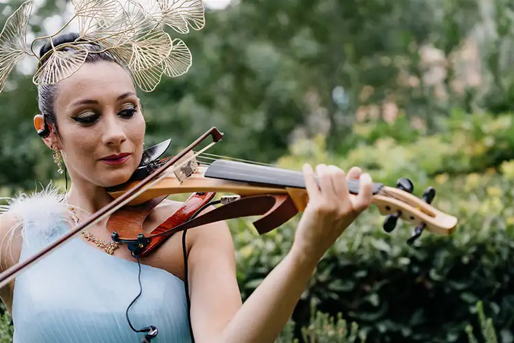 Live violinist performing during an outdoor wedding ceremony in Portofino