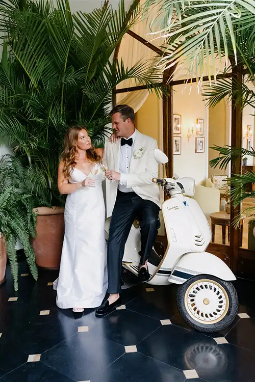 Bride and groom with vintage Vespa at Splendido Mare Belmond Hotel in Portofino