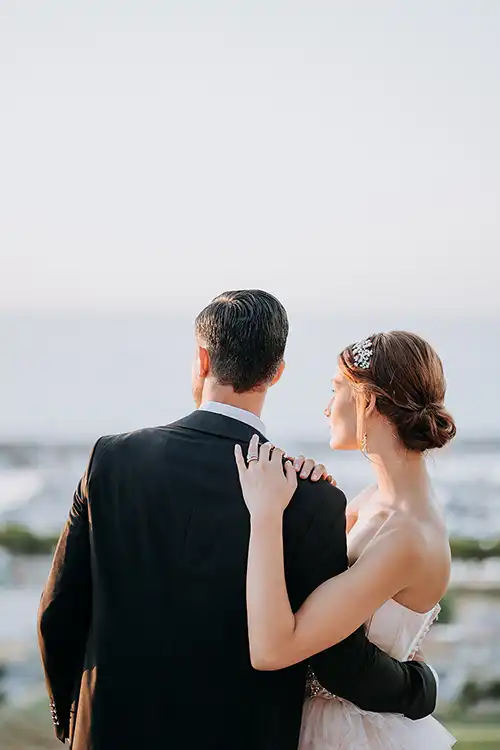 Bride and groom overlooking the sea at Villa Paola in Tropea