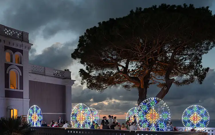 Traditional colourful lights during an evening wedding at Villa Paola