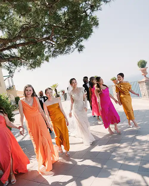 Bridesmaids wearing vibrant colours at a stylish destination wedding in Capri
