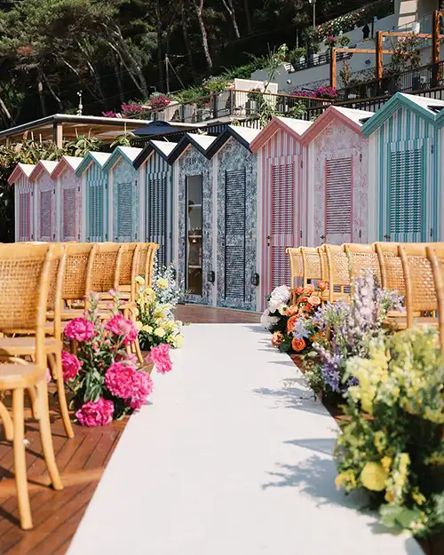Colourful wedding aisle décor overlooking the sea in Capri