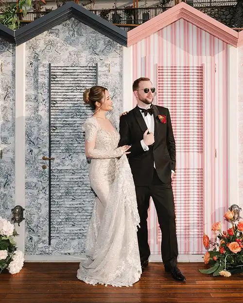 Bride and groom posing in a fashion-inspired setting in Capri
