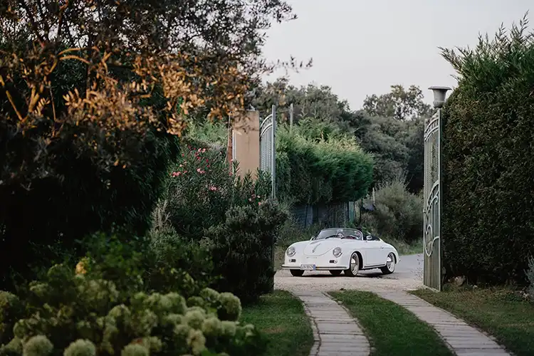 Vintage Porsche arriving at a countryside wedding venue in the Ligurian hills