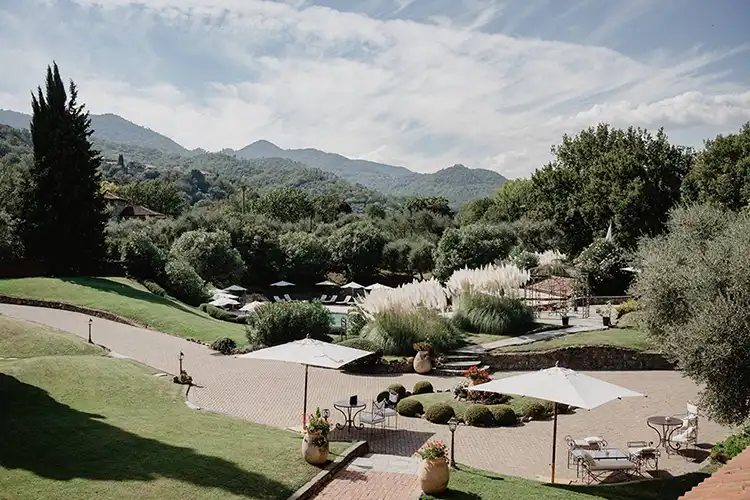 Panoramic view of a secluded wedding venue surrounded by Mediterranean gardens in Liguria