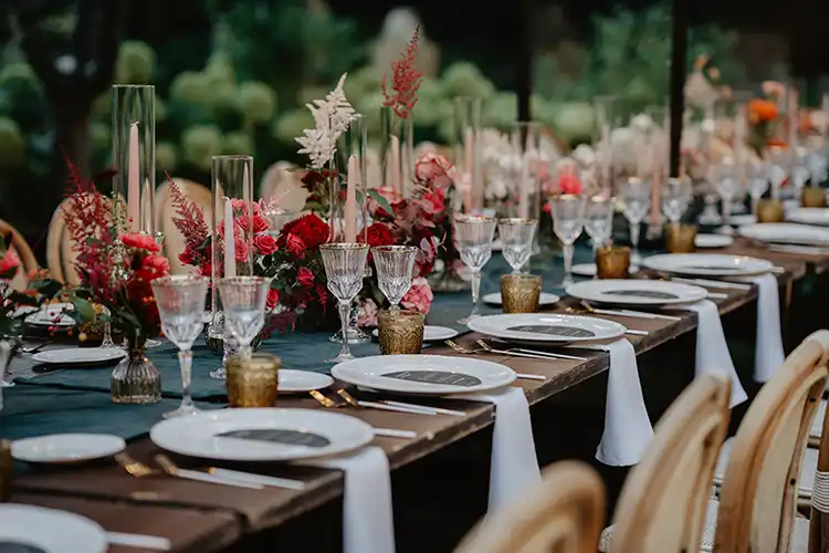 Elegant place setting prepared for an outdoor wedding reception in a Ligurian garden