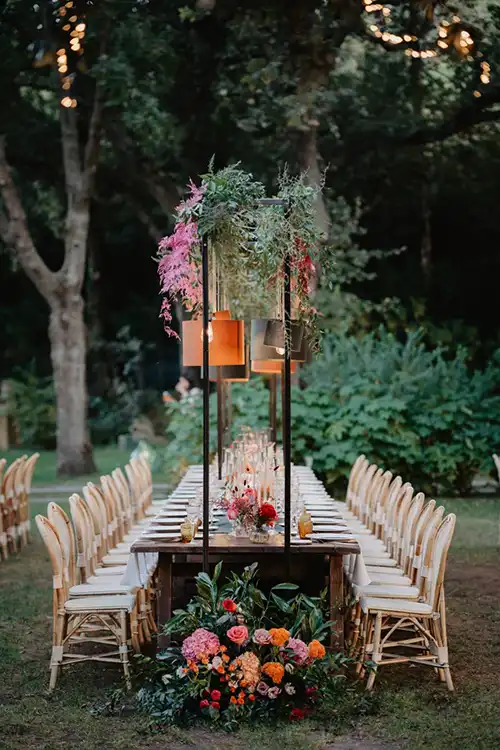 Long imperial table set for an elegant outdoor wedding reception in a Ligurian garden